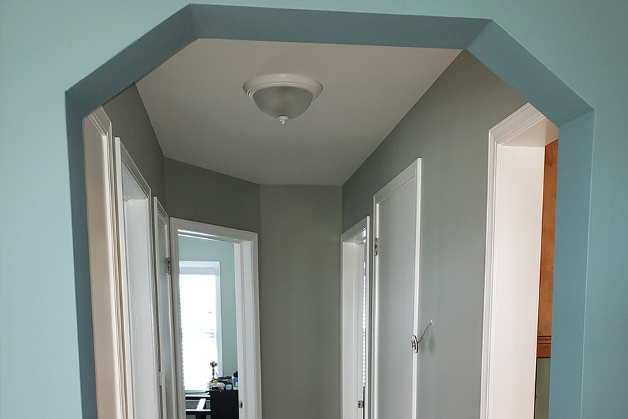 doorway-and-hallway-with-aqua-and-gray-walls-roseville-mi